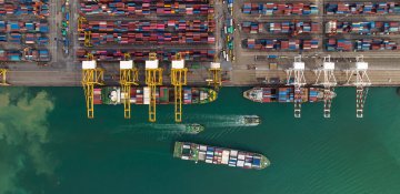 Three container ships at a container port.
