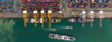 Three container ships at a container port.