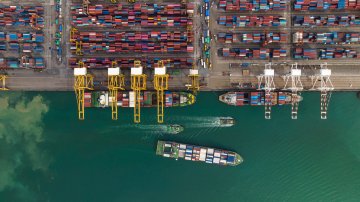 Three container ships at a container port.