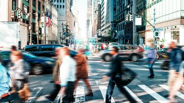 Image of a busy intersection with pedestrians